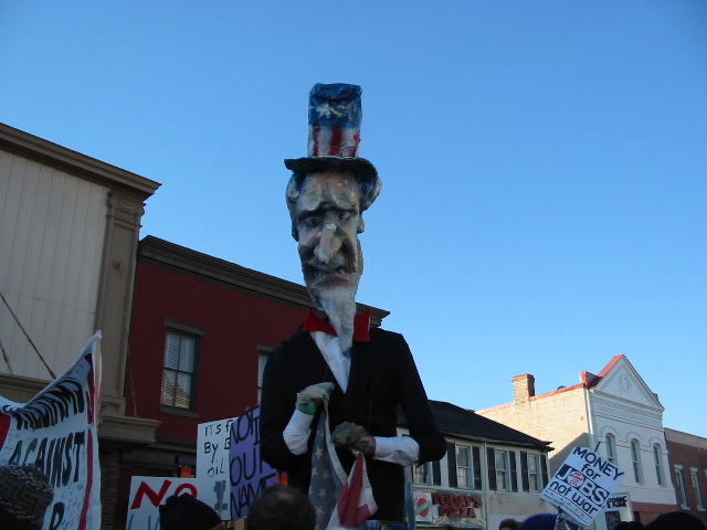 Uncle Sam looks down on the marchers.