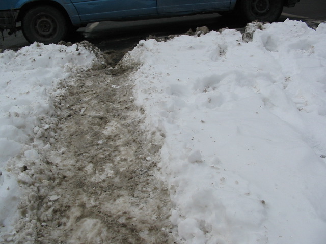 Second view of uncleared city sidewalk