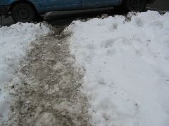 Second view of uncleared city sidewalk